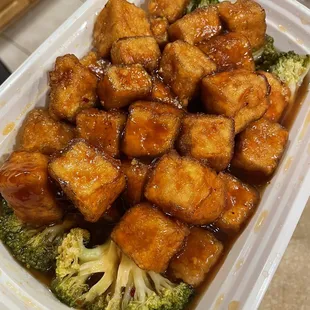 tofu and broccoli in a plastic container