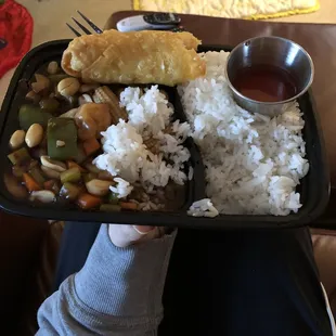 a person holding a tray of food