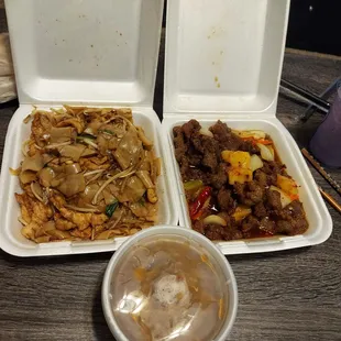 two take out containers of food