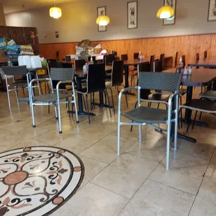 a restaurant with tables and chairs