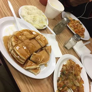 Pancakes, grits, and home fries.