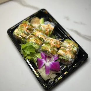 12. Angel Roll: Lobster tempura,lettuce topped w. crabmeat, avocado, tobiko, spicy mayo, mango sauce