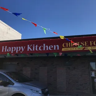 a car parked in front of a restaurant