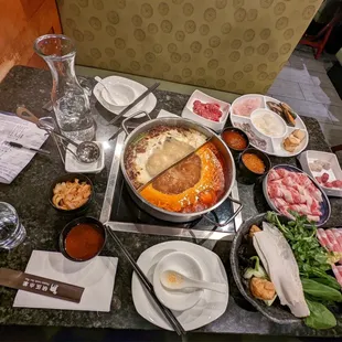 When all the food has arrived on first round (beef, lamp, meatballs, fish balls, seafood, veggies, and sauces)