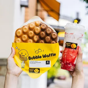a person holding a bag of bubble waffles