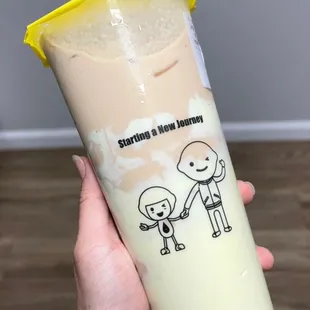  hand holding a cup of bubble tea