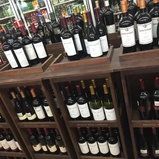 a large selection of wine bottles