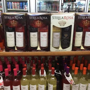bottles of wine on a shelf in a store