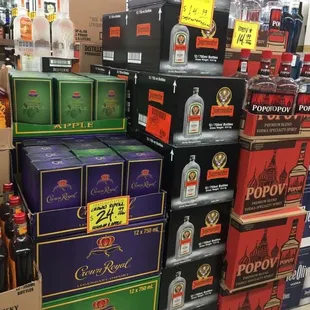 a large stack of liquor bottles