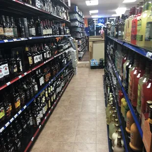 a wide aisle in a liquor store