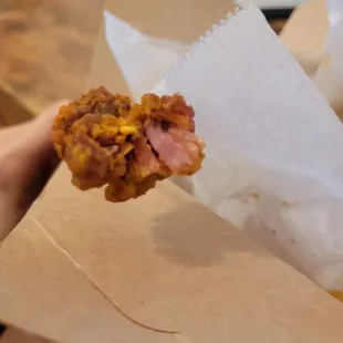 Undercooked popcorn chicken.