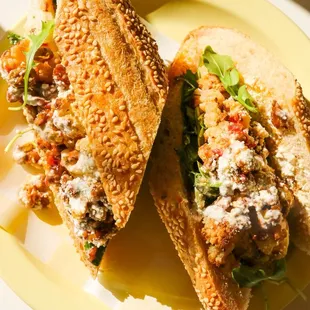 Roasted Cauliflower Sandwich: Whipped Tahini, Walnut-Sultana Relish, Cotija, Mint, Arugula, Village Hoagie Roll.