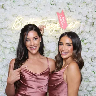 Our white flower wall and neon sign rental