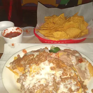Beef beans queso cheese. No begs  upcharge  $1 for onions. That does not make me happy.