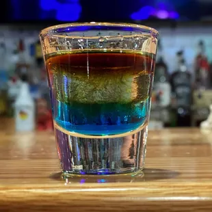 a shot of a rainbow drink