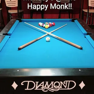 a pool table with a pool ball on it