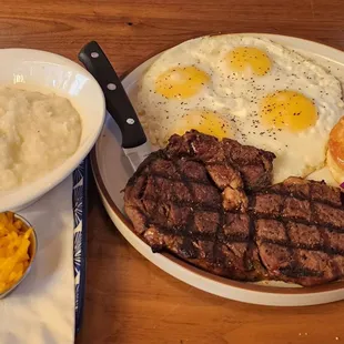 Steak and eggs (extra two per request) with grits and biscuit