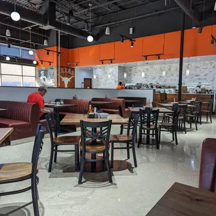 a man sitting at a table in a restaurant