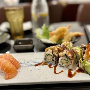 Sake nigiri $6.95 and dragon roll $14.95