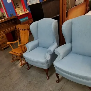 2 baby blue queen Ann chairs and a shaker style oak rocker located on the second floor