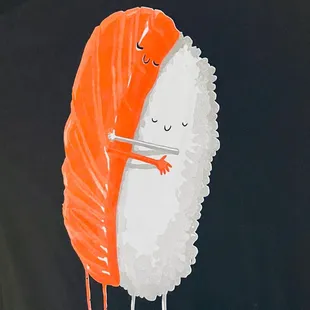 a piece of sushi on a black t - shirt