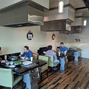 a group of people eating in a restaurant