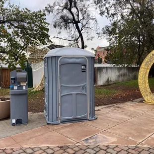 Handicap portable restroom potty. 
Hand washing station.