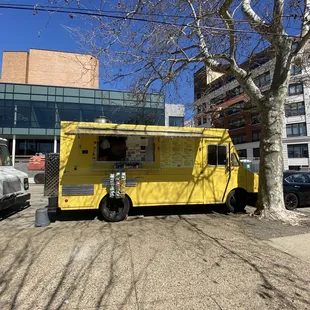 a bright yellow food truck