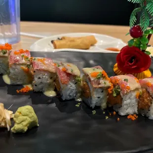 a plate of sushi and a glass of water