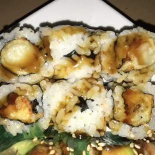 a plate of sushi rolls