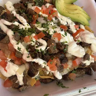 Nachos with steak- delicious! Love how they load them up!