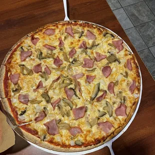 Large Canadian bacon, mushroom, onion pizza