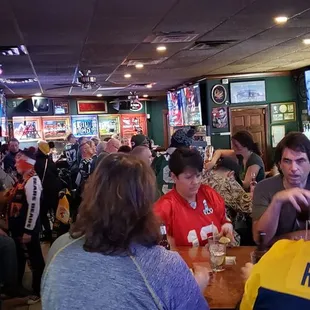 a large group of people in a sports bar