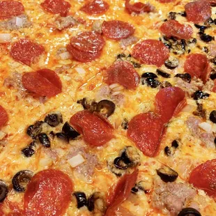 Sausage, pepperoni with onions- plus black olives on half