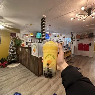 a person holding a cup of tea