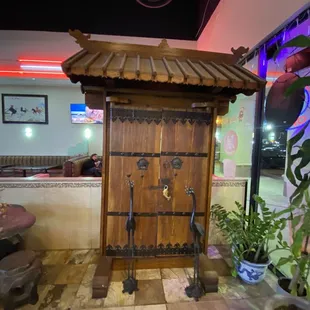 a tea house with a wooden door