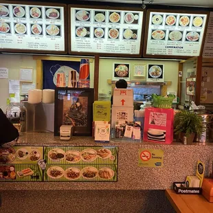 a woman ordering food at a restaurant