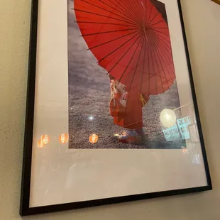 a woman holding a red umbrella