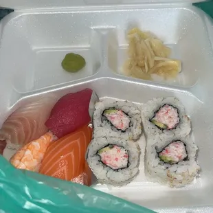 sushi in a styrofoam container