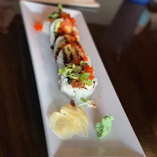 a plate of sushi rolls