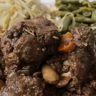 a plate of meat and vegetables