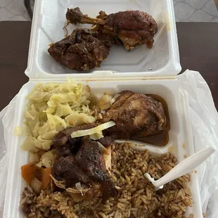 Stewed chicken with jerk sauce on top, rice and peas and cabbage!! So good!!