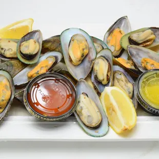 a plate of mussels and sauce