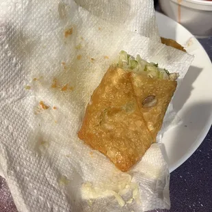 The third oil squeeze on the egg roll. The filling was really good but is cabbage instead of bean sprouts.