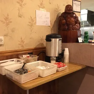 a coffee maker and baskets on a counter