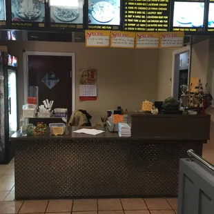 the counter and menus of a fast food restaurant