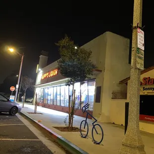 a bicycle parked in front of a store