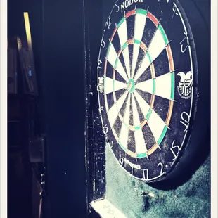 a dart in the center of a dartboard