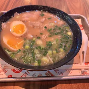 a bowl of ramen with an egg