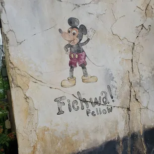 a mickey mouse painted on a wall